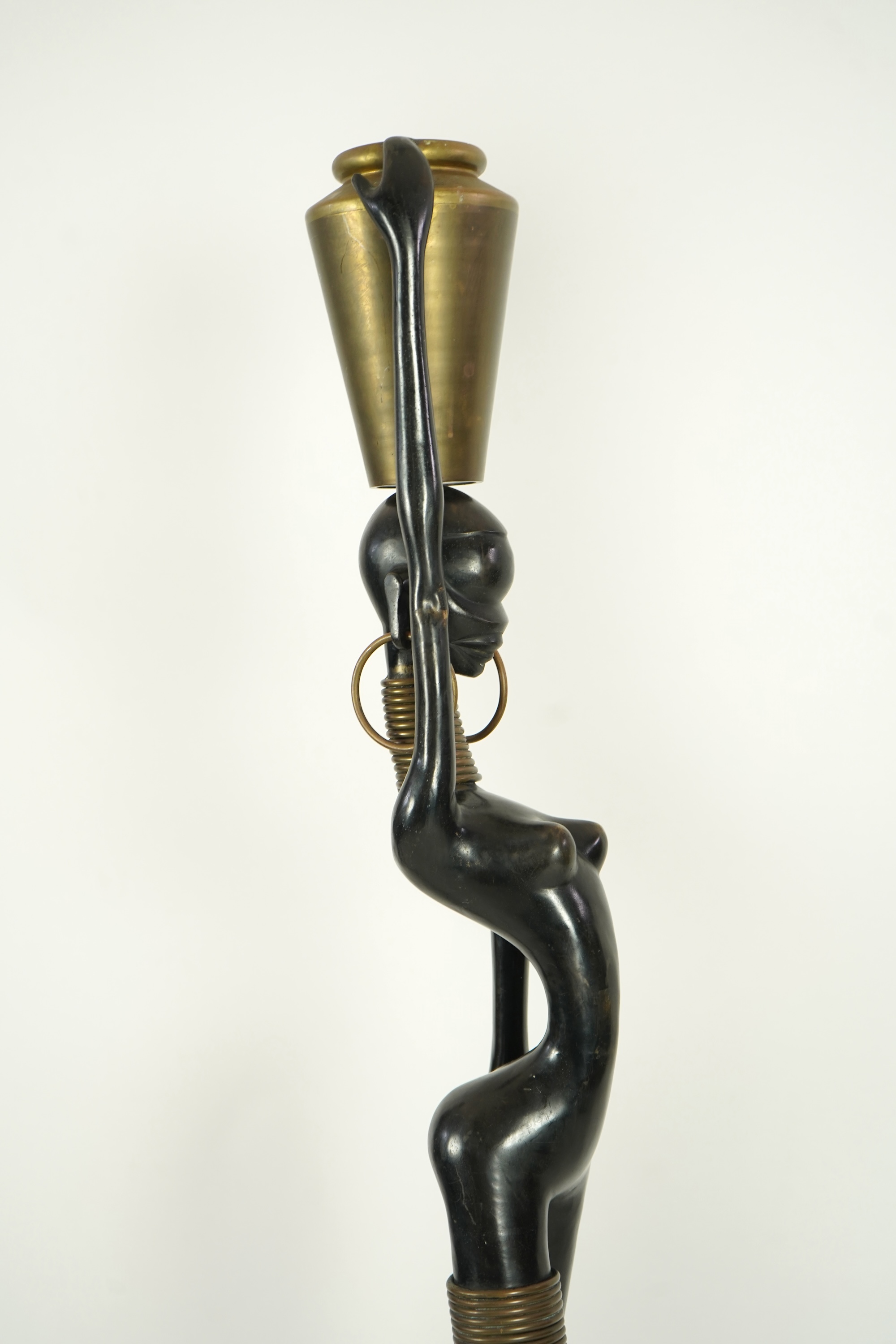 A large pair of Hagenauer style ebonised bronze 'Giraffe Woman' figures